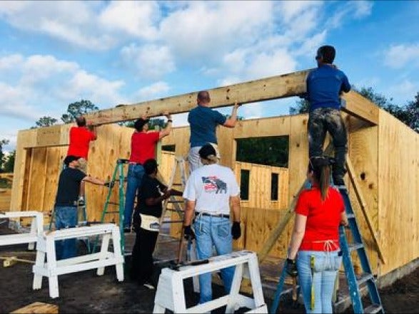 image of people building a house
