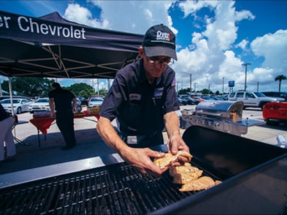 image of someone cooking on a grill