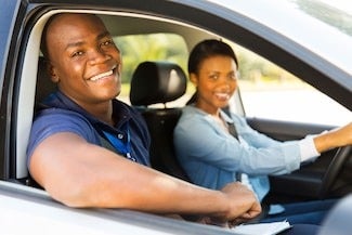 image of a couple looking out the passenger's side window