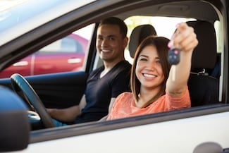 image of a couple looking out the driver's side window